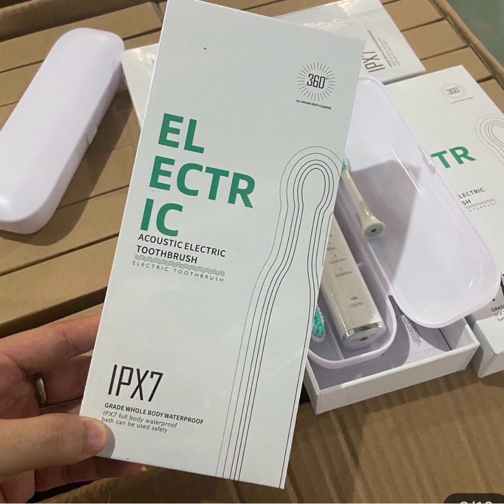 Electric Acoustic Toothbrush - White with Teal Accent NEW IN ORIGINAL WRAPPER